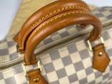 a close up of a purse on a table