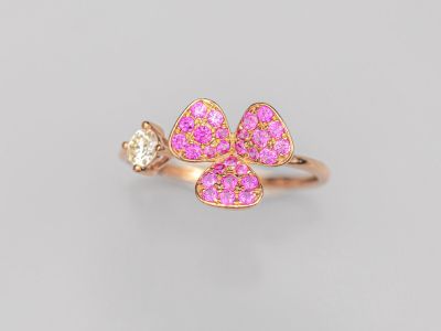 une bague en or sertie de diamants roses et blancs