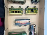 a box with a bunch of toy trains in it