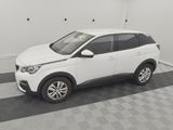 a picture of a white car parked in a garage
