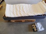 a mattress that is on a pallet in a room