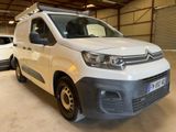 a white van that is parked in a garage