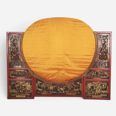 a large round table with a gold cloth on it
