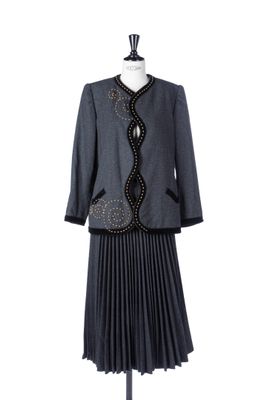 the dress and jacket are on display on the mannequin