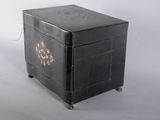 a small black box with a floral design on it