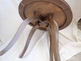 a wooden table with a wooden top on a white cloth