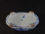 a blue and white bowl with a blue and white design on it