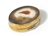 an image of a gold and agate ring with a large agate in the center