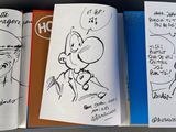 a lot of drawings on the pages of a book
