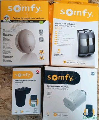 three boxes of sonfy products sitting on a wooden surface