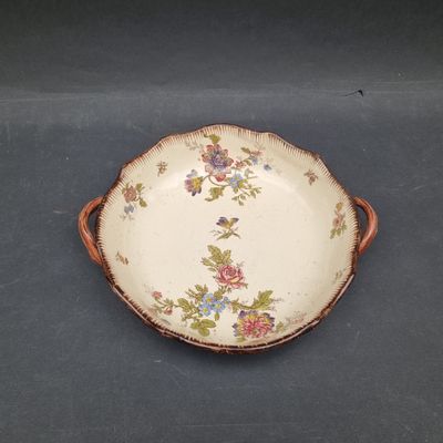 a plate with flowers on it sitting on a table