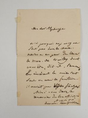 a piece of paper with writing on it sitting on a table