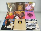 various album covers of various albums on a table