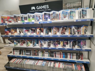 a lot of video games on the shelves in the store
