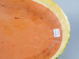 a close up of a watermelon with a label on it