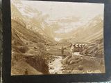 an old photo of a mountain village in the middle of a valley