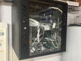 a wall mounted cabinet with a bunch of wires in it