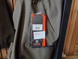 a pair of pants hanging on a rack in a clothing store