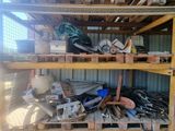 a lot of tools on the shelves in the shed