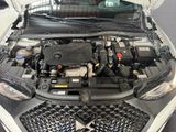 a car with its hood open and the engine in it