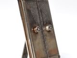 a small metal door that is on a stand