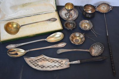 a lot of silver spoons and spoon spoons on a table