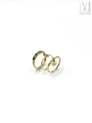 a close up of two gold rings on a white background