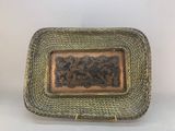 an antique brass plate with a picture of a man and a woman