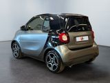 a smart car that is parked in a showroom