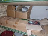 many boxes on the shelves in the room