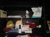a shelf with many items on it and a baby in it
