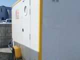 an image of a white trailer parked in a lot