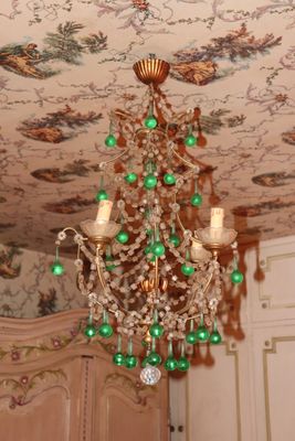 a chandelier hanging from the ceiling in a room
