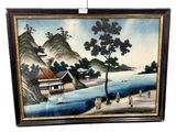 framed picture of a painting of a village by the water