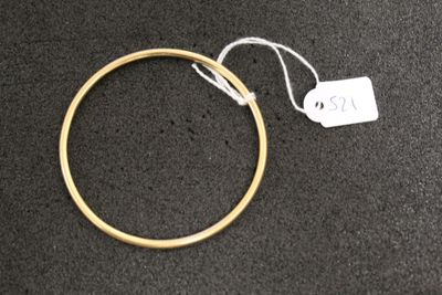 a close up of a gold ring with a price tag on it