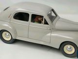 a toy car that is sitting on a white surface