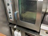 a small oven sitting in the middle of a kitchen