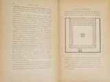 an open book with a picture of a square on it