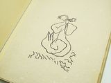 a book with a drawing of a woman on it