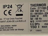 a sign on the side of a refrigerator that says thermo