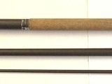 three different types of fishing rods on a white surface
