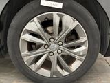 a close up of a car tire with a sticker on it