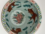 a bowl with a bird design on it on a table