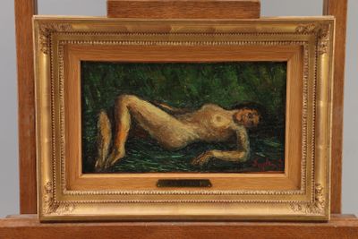 une photo d'un tableau représentant une femme nue allongée dans l'herbe