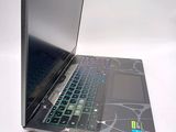 a laptop that is open on a white surface