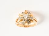 an image of a yellow gold ring with a diamond center