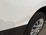 a white car with a black stripe on the side of it