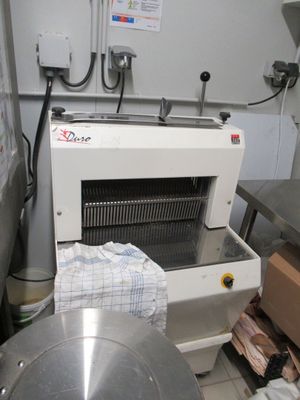 a machine that is sitting in a kitchen next to a table