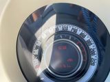 a close up view of a speedometer on a toilet
