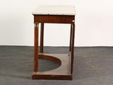 a small table that has a marble top on it